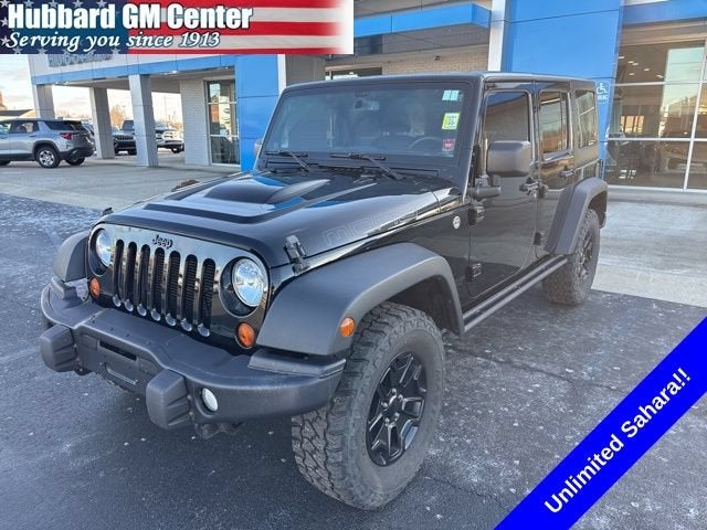 2013 Jeep Wrangler Unlimited Moab in Black — front three-quarter view